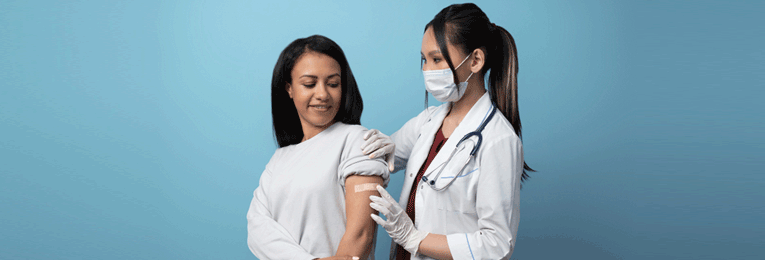 Illustration of a female doctor treating a female patient’s wound on her left arm with care and precision